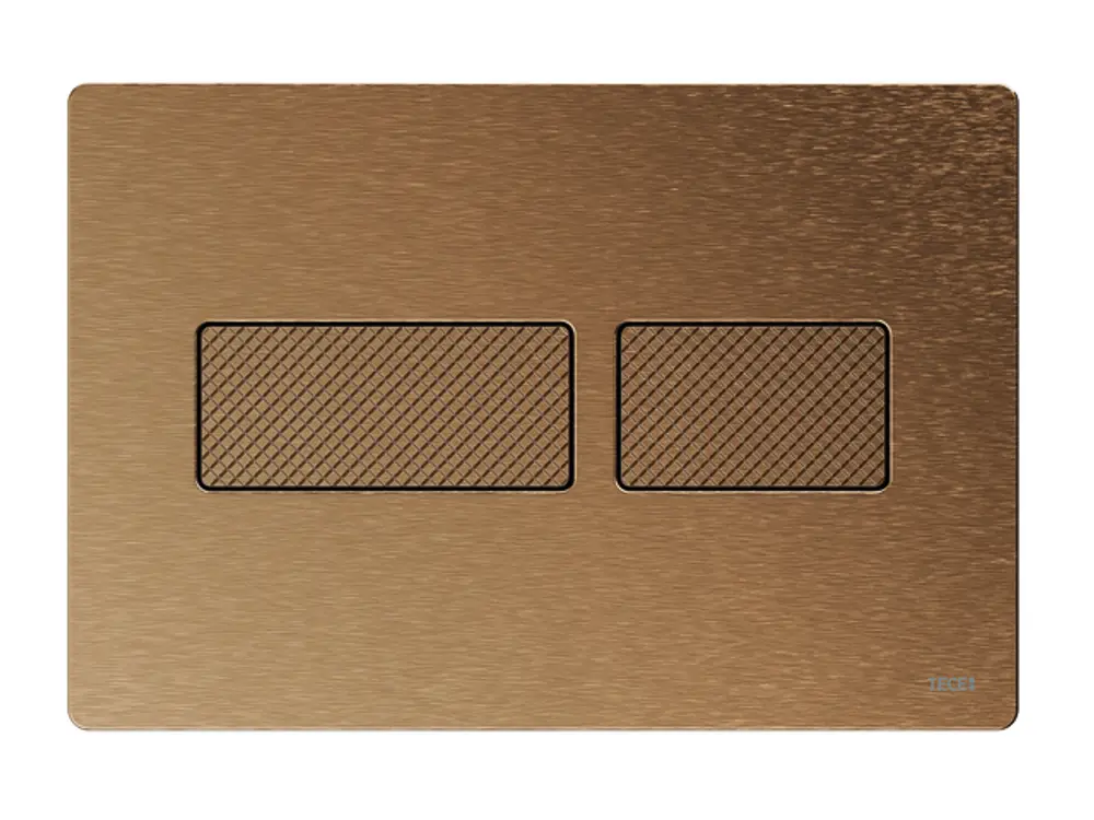 Betätigungsplatte in Bronze mit gebürsteter Oberfläche und Rautenstruktur, gefertigt von TECE. Geeignet für WC-Installation, mit zwei Betätigungselementen.